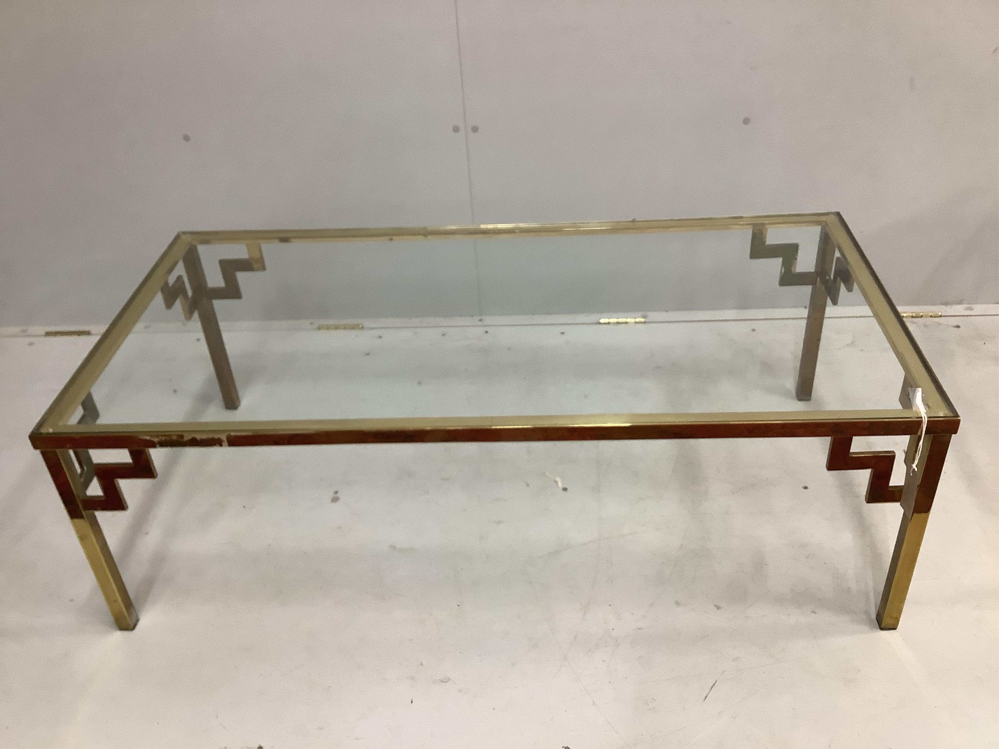 A pair of mid century brass and clear glass top coffee tables, width 122cm, depth 62cm, height 41cm. Condition - fair